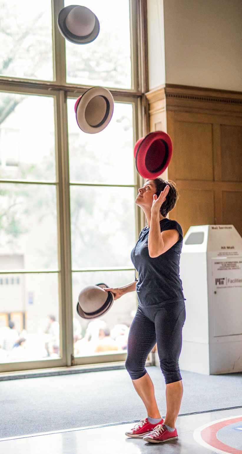 person juggling hats