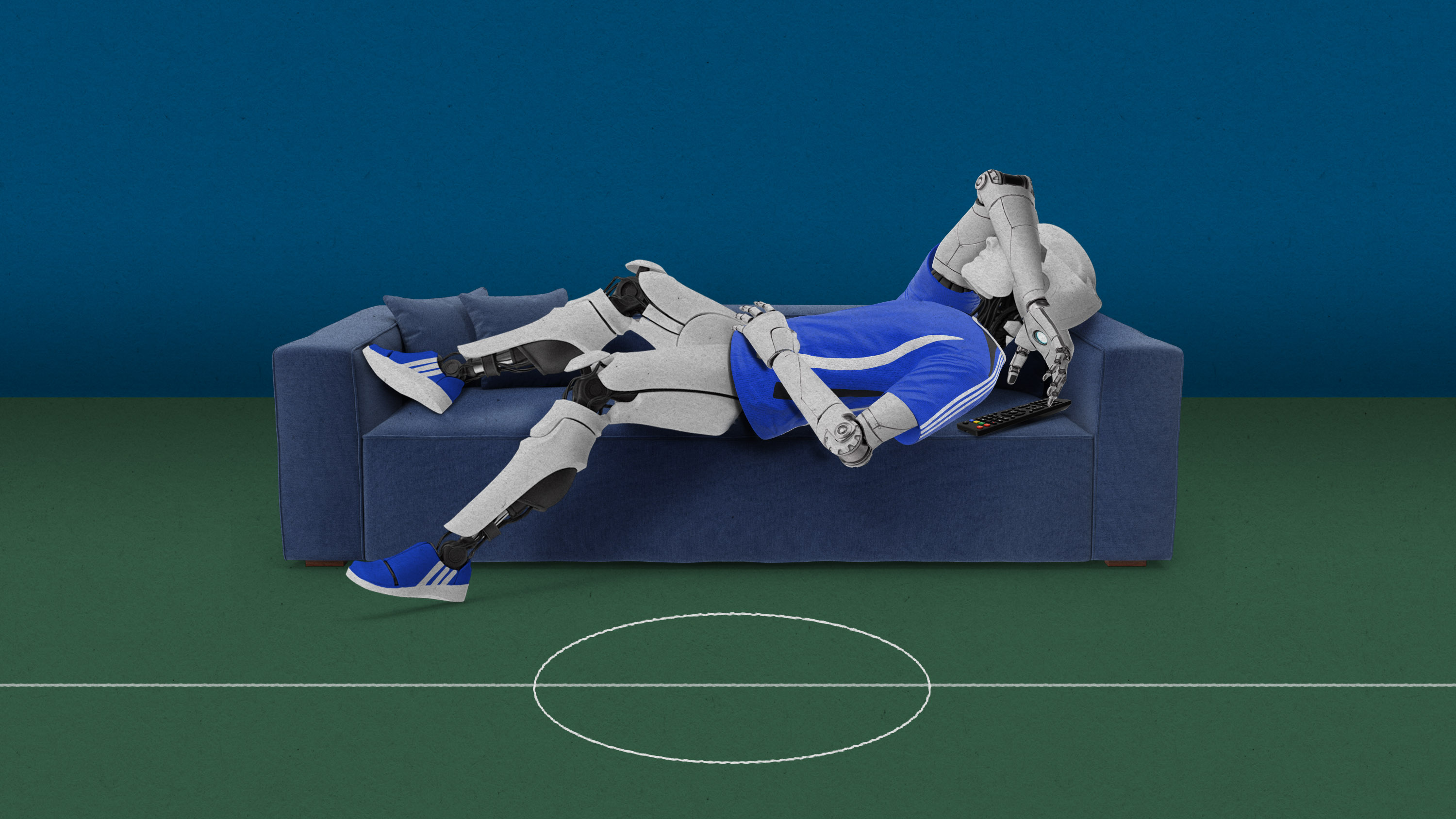 a soccer playing robot laying on a couch