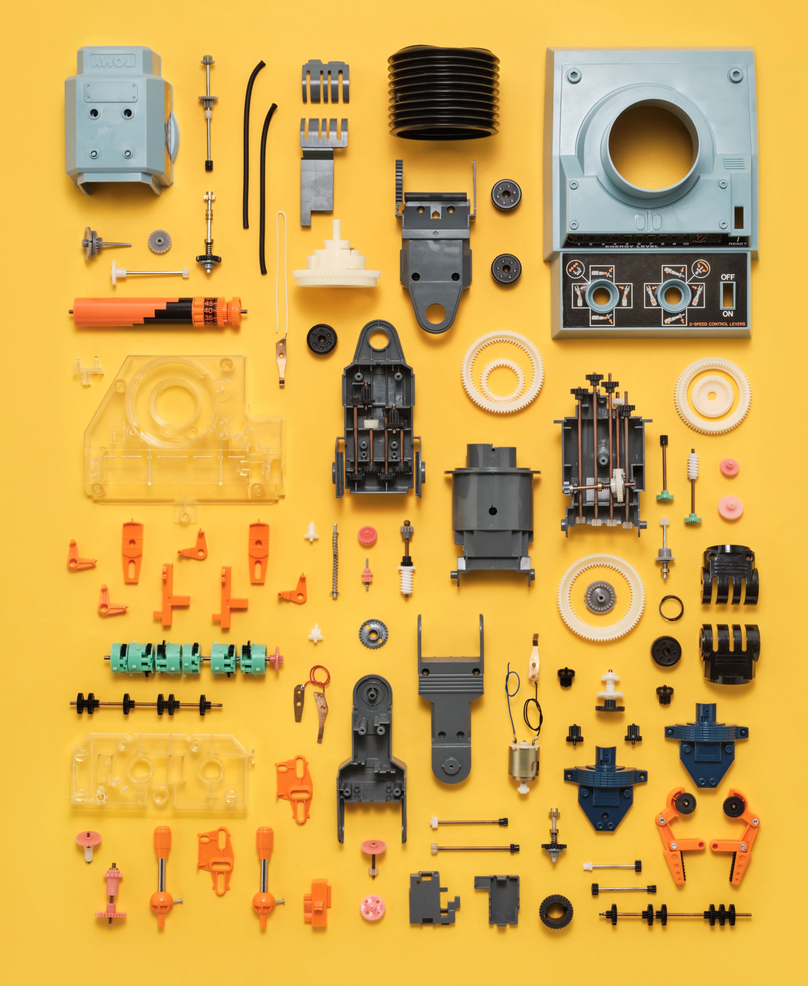 pieces of the armatron disassembled and arranged on a table